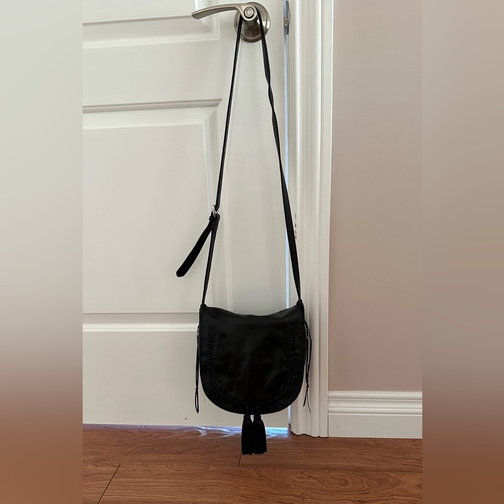 Lucky Brand women black crossbody purse with front tassels with adjustable strap